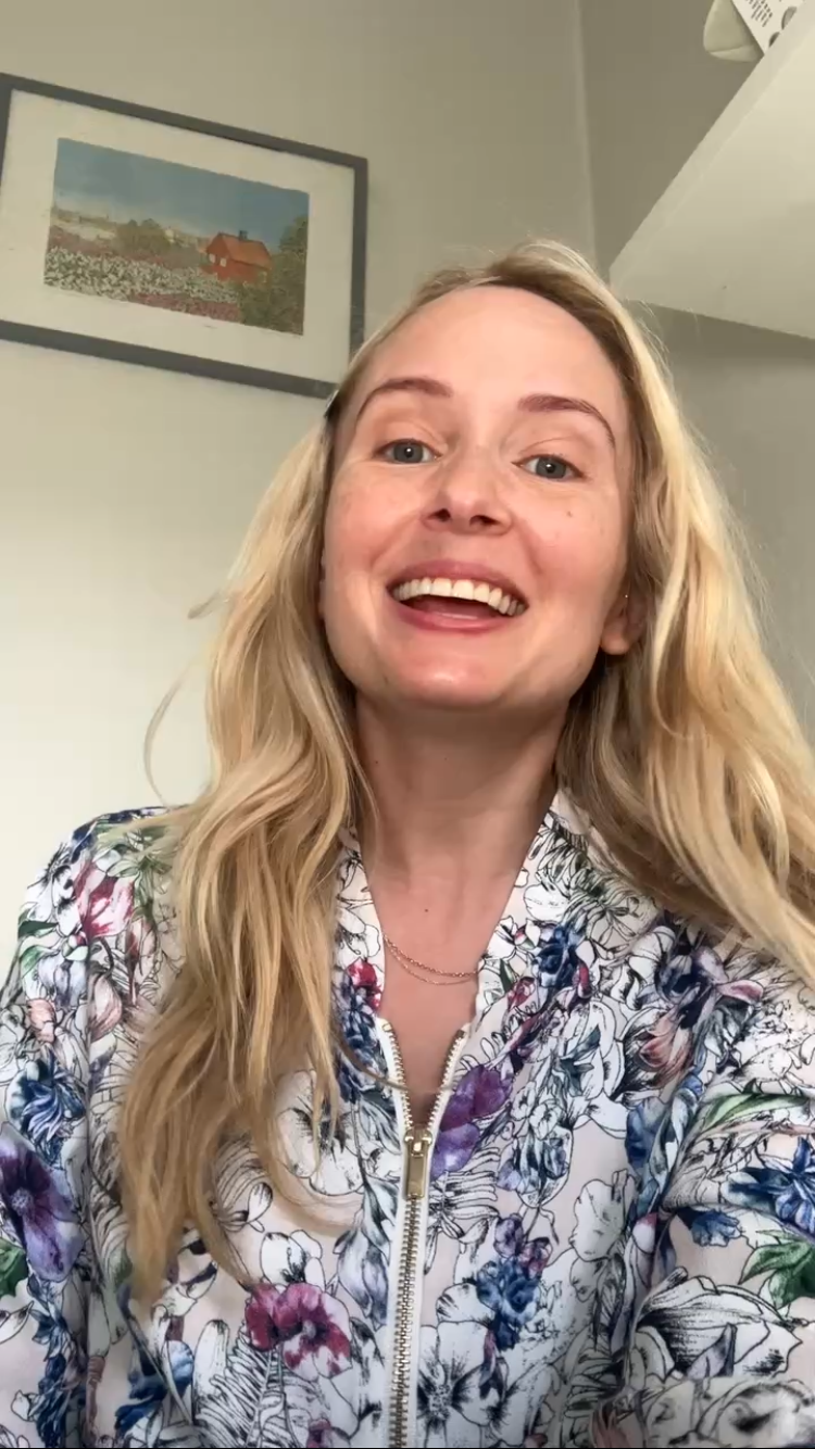 Linksandmaria in a flower sweater talking